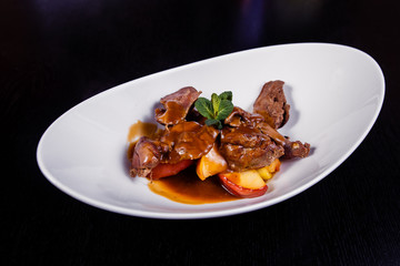 Duck liver with berry sauce and apples decorated with rosemary