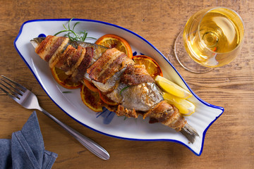 Grilled Bacon-Wrapped Whitefish. Fish wrapped with bacon. View from above, top