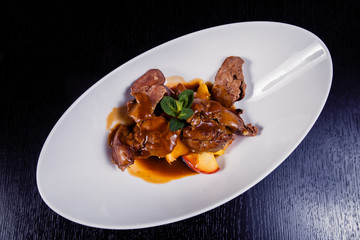 Duck liver with berry sauce and apples decorated with rosemary