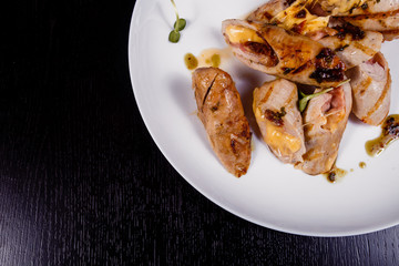 Spicy chicken fillet baked with bacon, tomatoes and cheddar cheese