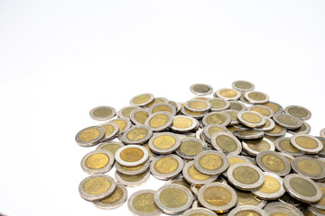 Currency in Thai baht Coin with golden and silver color on white background. Abstract of saving money