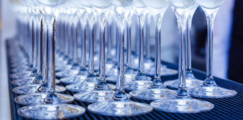 Glasses with champagne lined up in a row