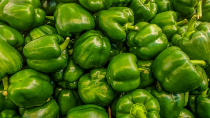 Obraz na płótnie Canvas a tray of green pepper (green capsicum) found in a market