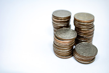 Currency in Thai baht with silver coins on white background. Abstract of saving money