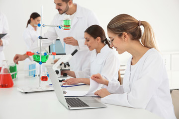 Medical students working in modern scientific laboratory