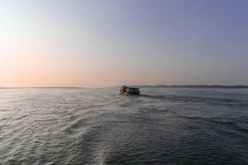 Sunrise over the Irrawaddy River seen from a Passanger Boat traveling from Mandalay to Bagan