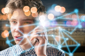 young man communicating via futuristic phone, virtual network hologram b