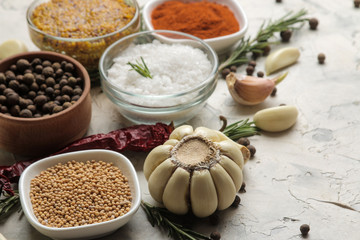 herbs and spices. various seasonings, herbs and spices on a light concrete background.