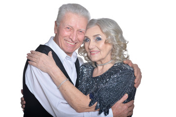 Portrait of happy senior couple hugging isolated