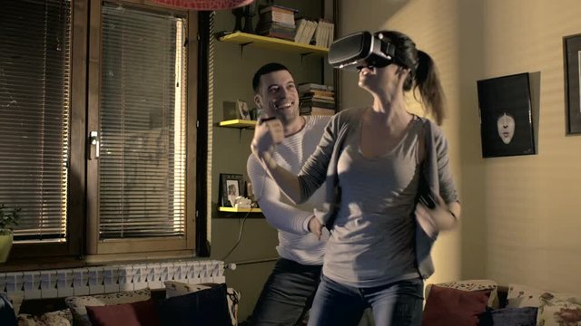 Boyfriend and girlfriend playing virtual reality game
