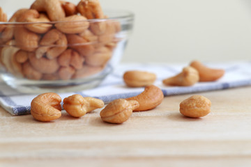 Cashew nuts in a cup and placed on the table.