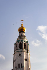 Birds flying around bell tower of St. Sophia Cathedral of Vologda