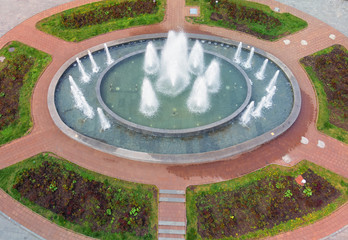 Beautiful fountain with clear blue water - top view