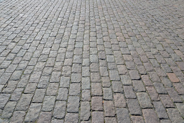 Obraz premium Old cobblestone pavement close-up.