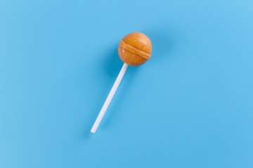 Fototapeta na wymiar lollipop on the blue backgrouns