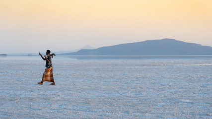 Sunset on the salt plains of Asale Lake in the Danakil Depression in Ethiopia, Africa