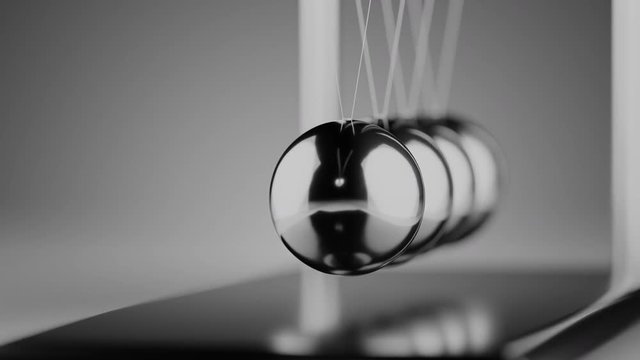 Camera moves around newton cradle. Physics concept.