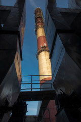 industrial white, red, high concrete chimney