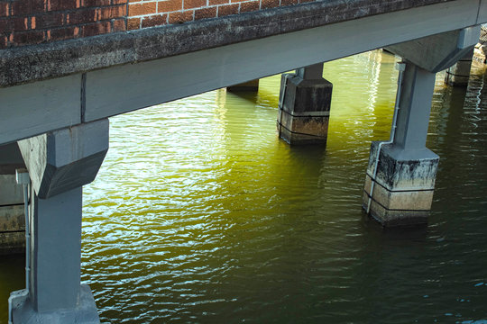 under the bridge 2 with pillons water concrete road car traffic