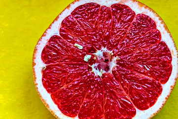 grapefruit on yellow background