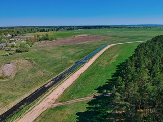 Fototapeta na wymiar Aerial view of the edge of pine forest in Minsk Region of Belarus