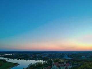 Foto op Canvas Sunset over the lake in Nesvizh in Minsk Region of Belarus © Egor Kunovsky