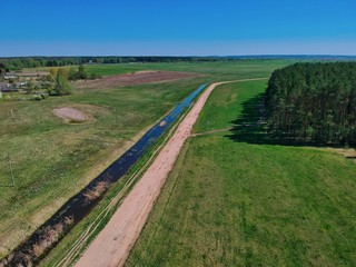 Fototapeta na wymiar Aerial view of a forest edge in Belarus countryside