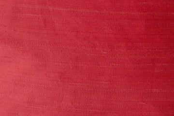 Close up of a woolen fabric of red violet color. Abstract canvas background, empty template.