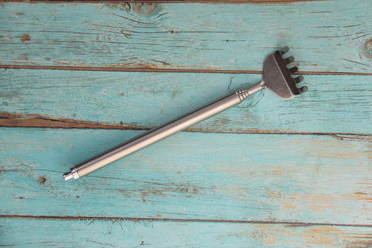 Gratte-dos t&eacute;lescopique