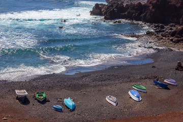 El Golfo, Spain 03-12-2019. Boats on beach near El Golfo village at Lanzarote. Canary Islands. Spain