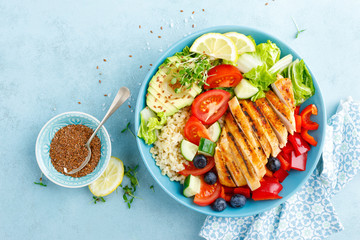 Lunch bowl with grillet chicken breast, fillet, bulgur and fresh vegetable salad