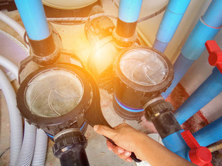 Clear the sand filter of the pool.Service and maintenance of the pool.Black wash filter tank of the...