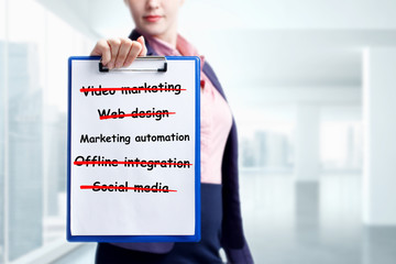 Business, technology, internet and networking concept. Young entrepreneur showing keyword:...