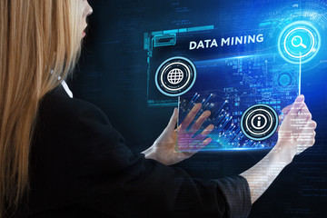 The concept of business, technology, the Internet and the network. A young entrepreneur working on a virtual screen of the future and sees the inscription: Data mining