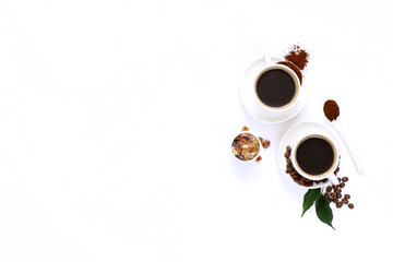 Two cups of espresso . Coffee beans, ground coffee on white background