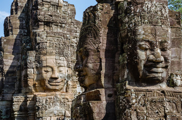 Smiling Faces of Bayon Temple in Angkor Thom is The Heritage of Khmer Empire at Siem Reap Province,...