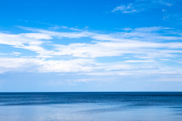 Fototapeta na wymiar Beautiful blue seascape with white clouds in the sky. Great Ladoga lake, Karelian sea.