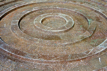 A fragment of the ring of the inspection sewer manhole made of polymer sand mixture.