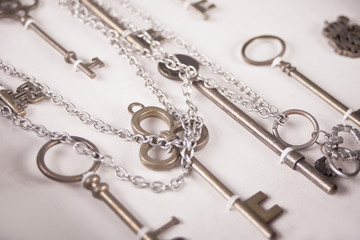 View at vintage metal keys on the white background