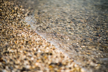 A swift mountain river, shore of pebbles. Flows through the coniferous forest