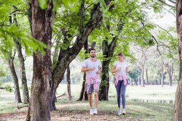 Fototapeta premium Beautiful couple jogging in park living,Concept healthy in nature