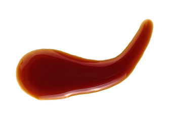 Spilled soy sauce isolated on white background, top view.