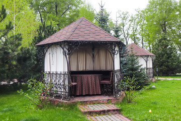 street houses for privacy at a restaurant on the street.