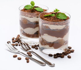 two portions Classic tiramisu dessert in a glass isolated on a white background