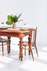 Beautiful wooden table and two chairs in room