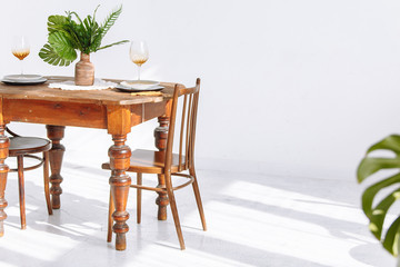 Beautiful wooden table and two chairs in room