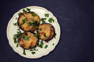 stuffed mushrooms with cheese and herbs on white beautiful dish