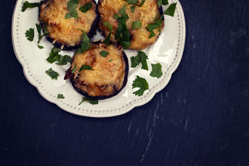 stuffed mushrooms with cheese and herbs on white beautiful dish