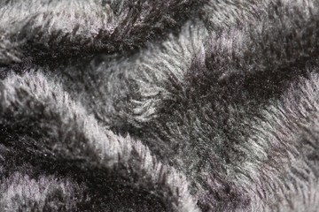 Texture of fur of wild animals background. Line wool floor with black light.