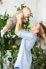 Obraz premium Cute young mother holds her little beautiful baby